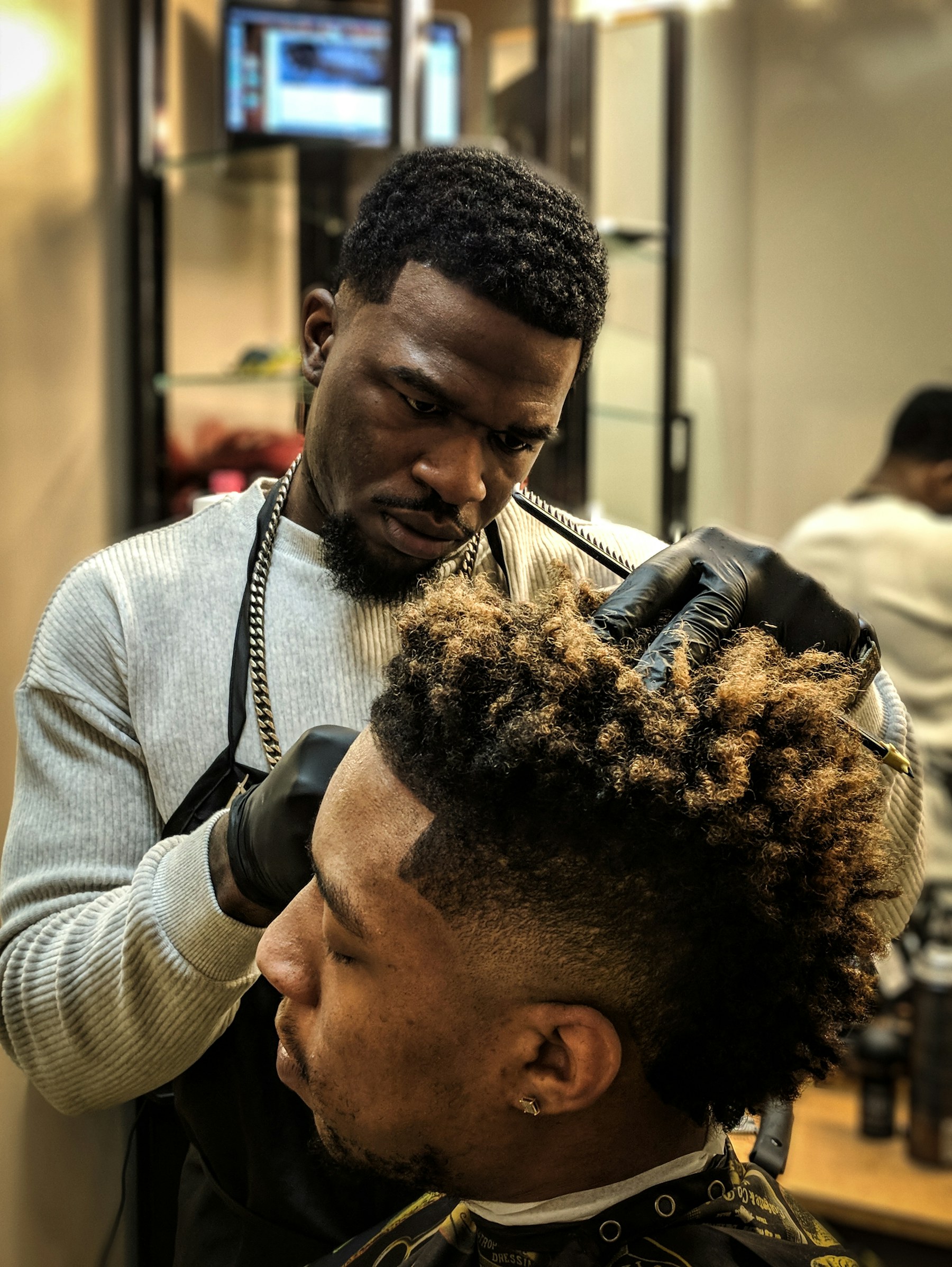 Barber shaping a client profile